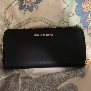 Large black Michael Kors zip around wallet